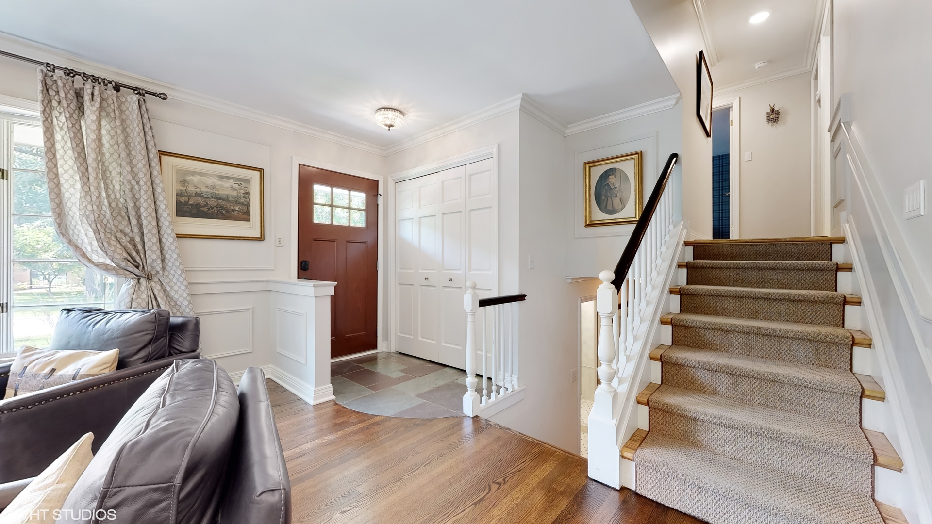 15 Winston Road Lake Forest, IL 60045 - Photo 4 of 26 a view of a livingroom with wooden floor and stairs