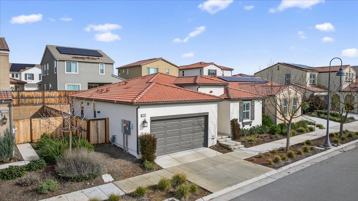 4593 Orchard Hills Road Madera, CA 93636 - Photo 2 of 25 a front view of a house with garden