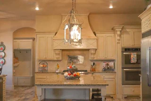 a bathroom with a tub sink shower and mirror