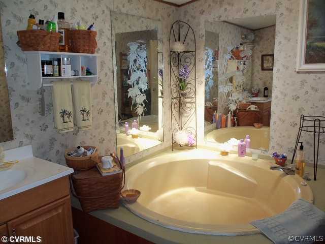 217 Jennings Road Cartersville, VA 23027 - Photo 9 of 12 Master Bath - His & her vanity, corner tub & separ