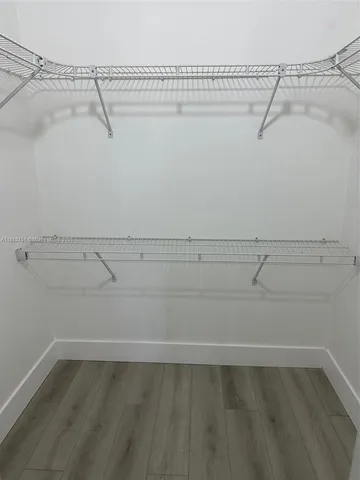 a view of a room with racks on the wall