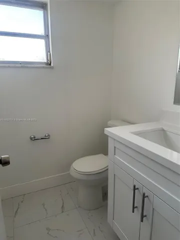 a bathroom with a toilet and a sink