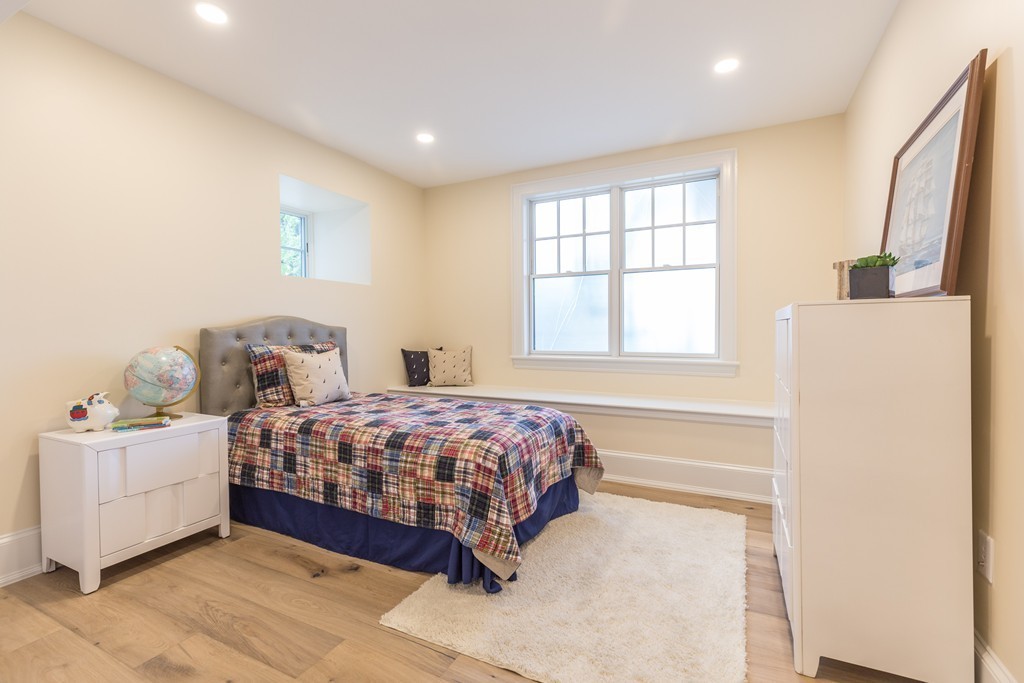 31 Summit Avenue, Unit 1 Brookline, MA 02446 - Photo 12 of 18 a bedroom with a bed and a window