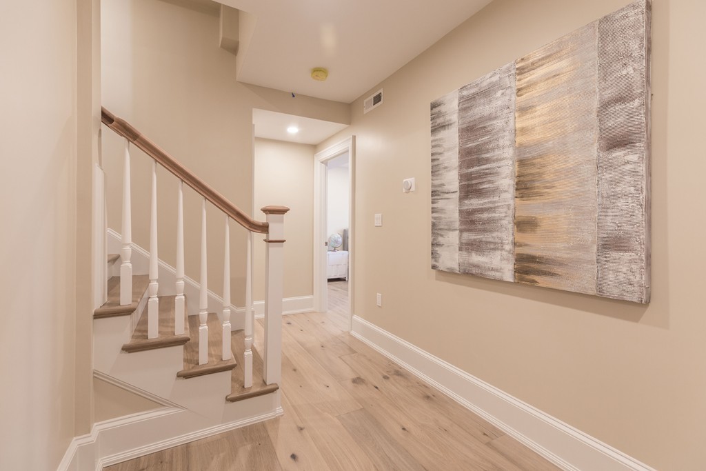 31 Summit Avenue, Unit 1 Brookline, MA 02446 - Photo 13 of 18 a view of an entryway with wooden floor