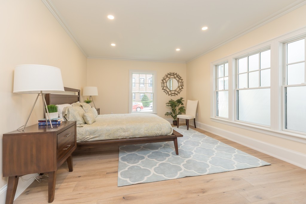 31 Summit Avenue, Unit 1 Brookline, MA 02446 - Photo 14 of 18 a living room with furniture and a window
