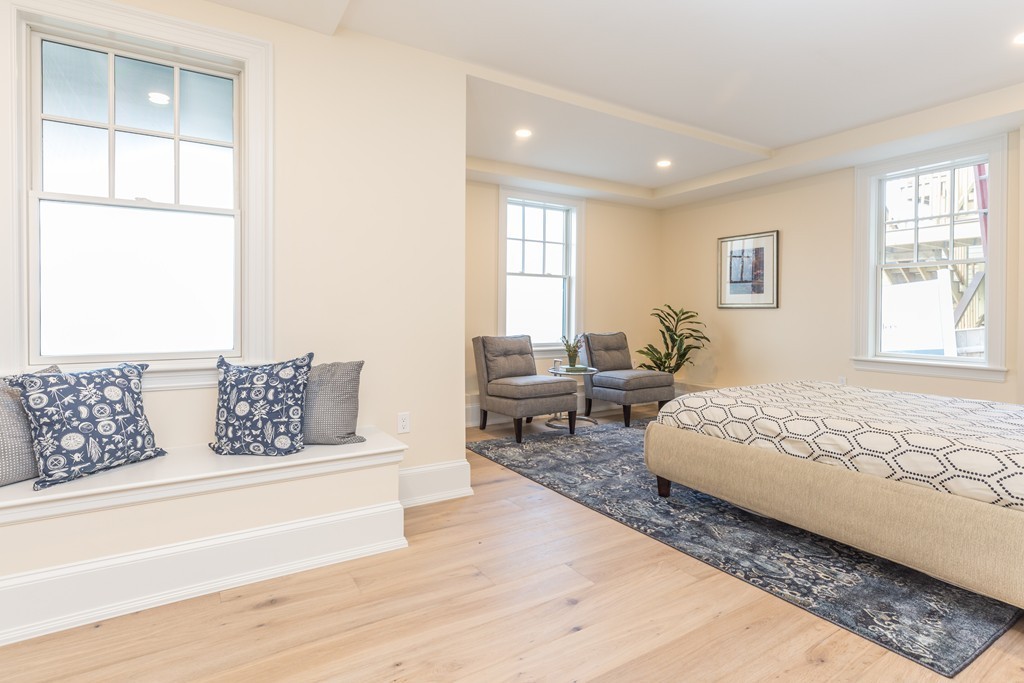 31 Summit Avenue, Unit 1 Brookline, MA 02446 - Photo 9 of 18 a living room with furniture and a window