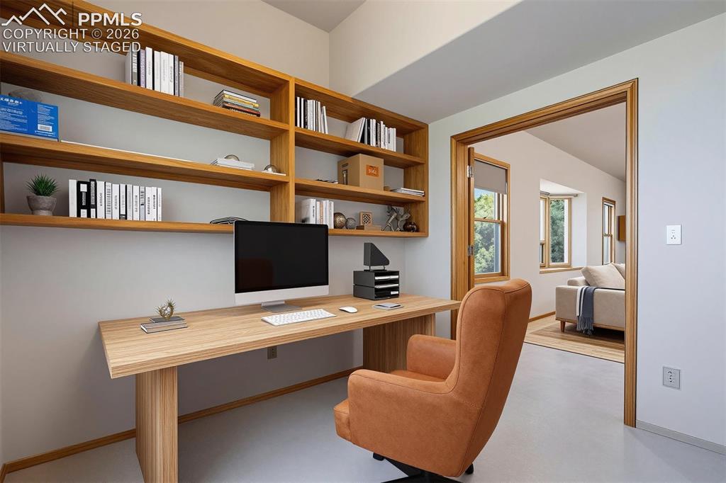 2550 Slocum Road Peyton, CO 80831 - Photo 22 of 50 virtually staged Built-in wood-finish shelving and desk unit