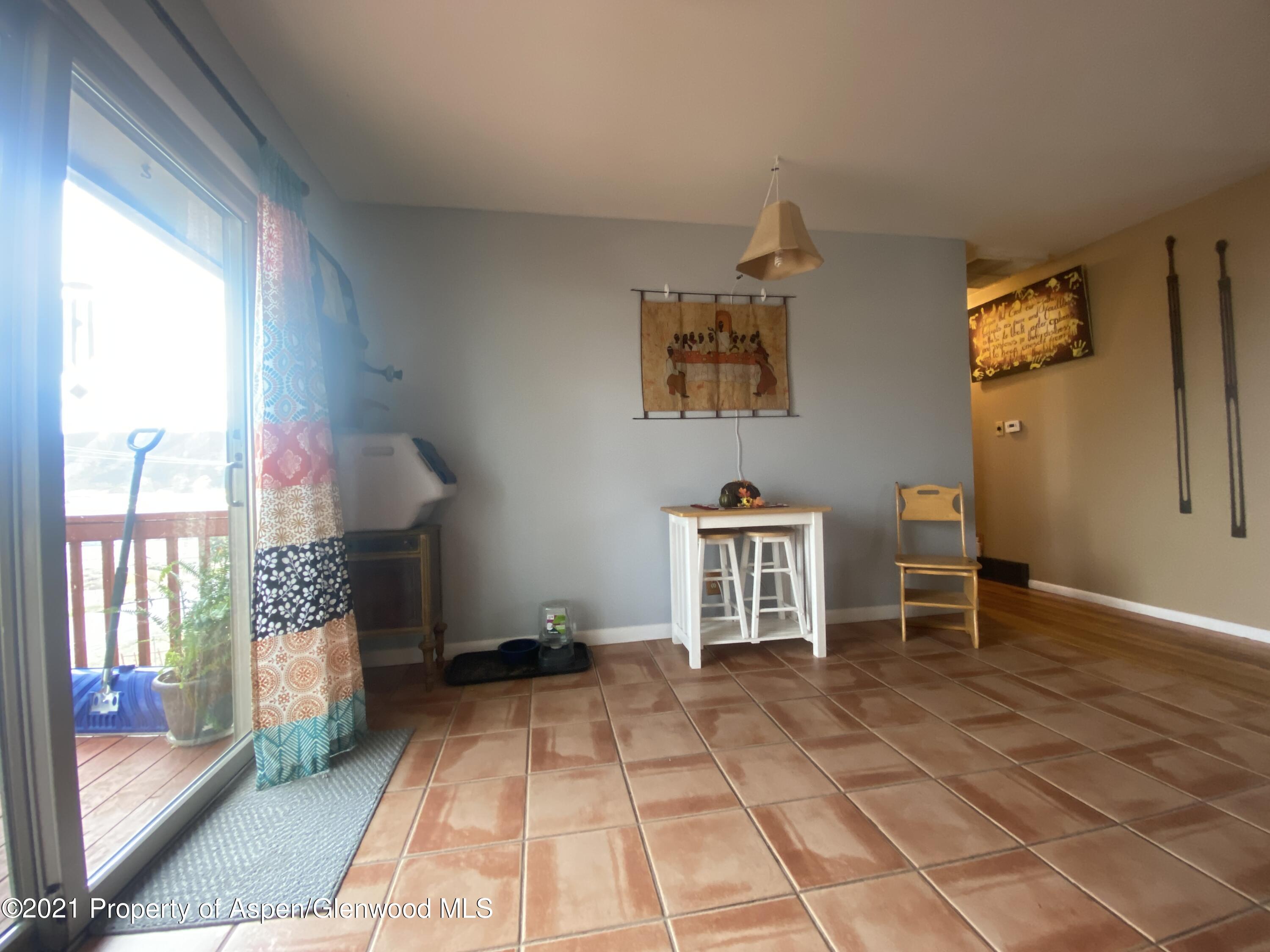 404 Hutton Avenue Rifle, CO 81650 - Photo 11 of 27 a room with furniture and window