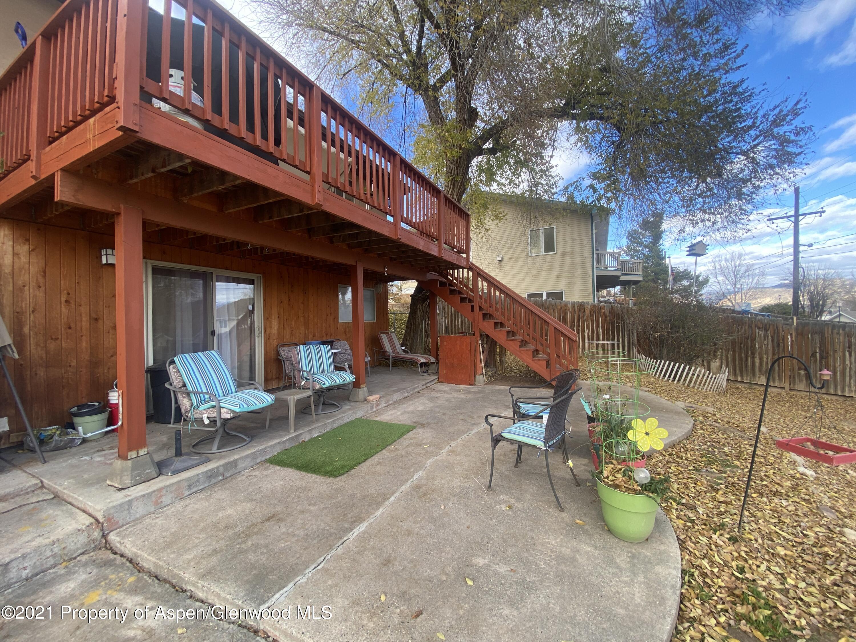 404 Hutton Avenue Rifle, CO 81650 - Photo 24 of 27 a view of a chairs and table in backyard