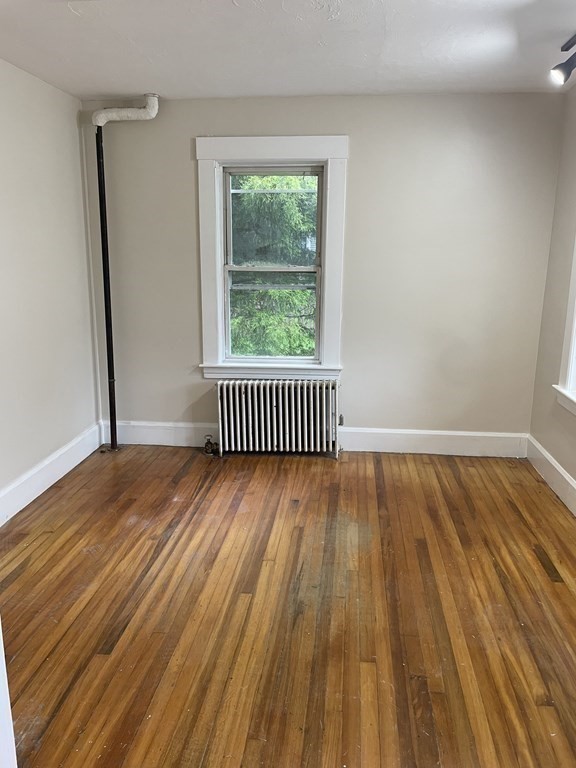 28 Carpenter Road Dudley, MA 01571 - Photo 4 of 6 a view of wooden floor in a room