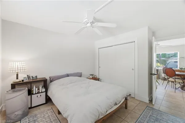 a bedroom with a bed and a table in it
