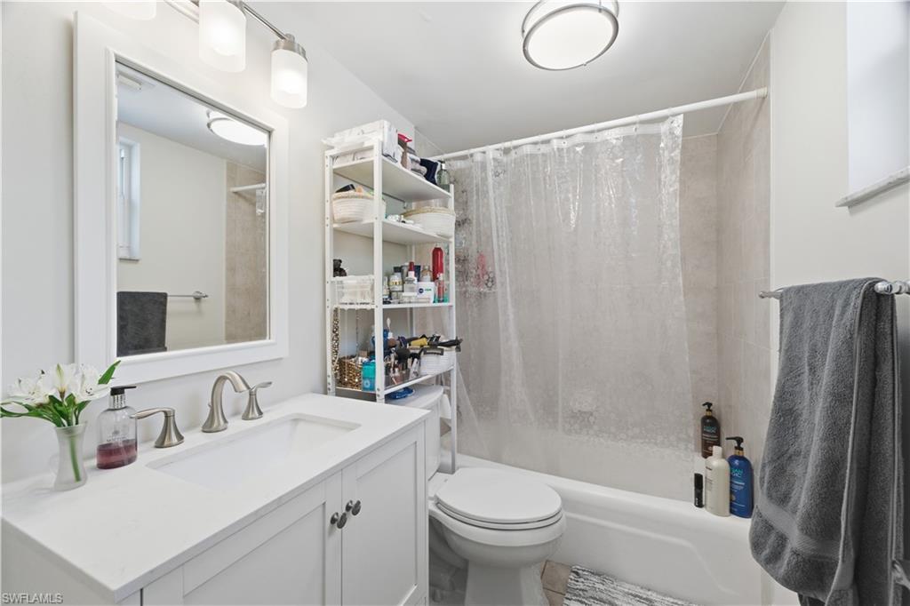 975 9th Avenue South, Unit 2 Naples, FL 34102 - Photo 13 of 18 Full bath featuring shower / tub combo and vanity