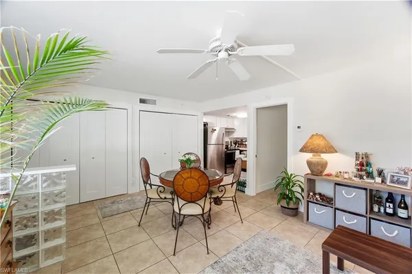 a living room with furniture a rug and a chandelier