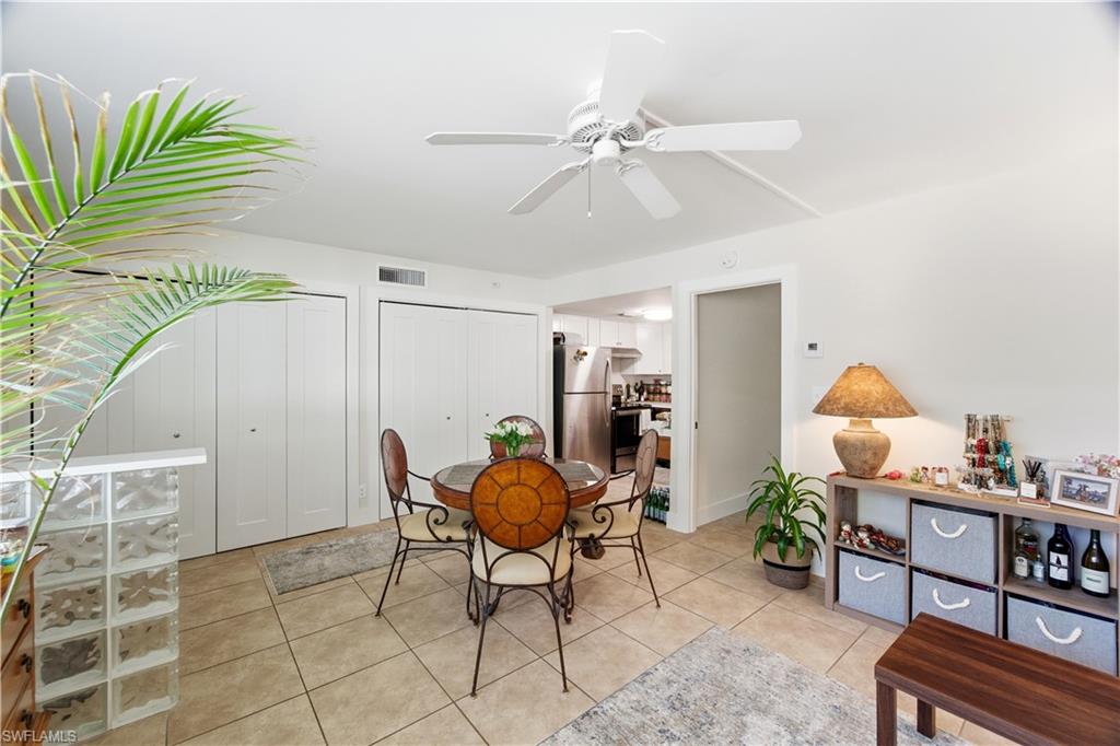 975 9th Avenue South, Unit 2 Naples, FL 34102 - Photo 7 of 18 Dining space with light tile patterned flooring and ceiling fan