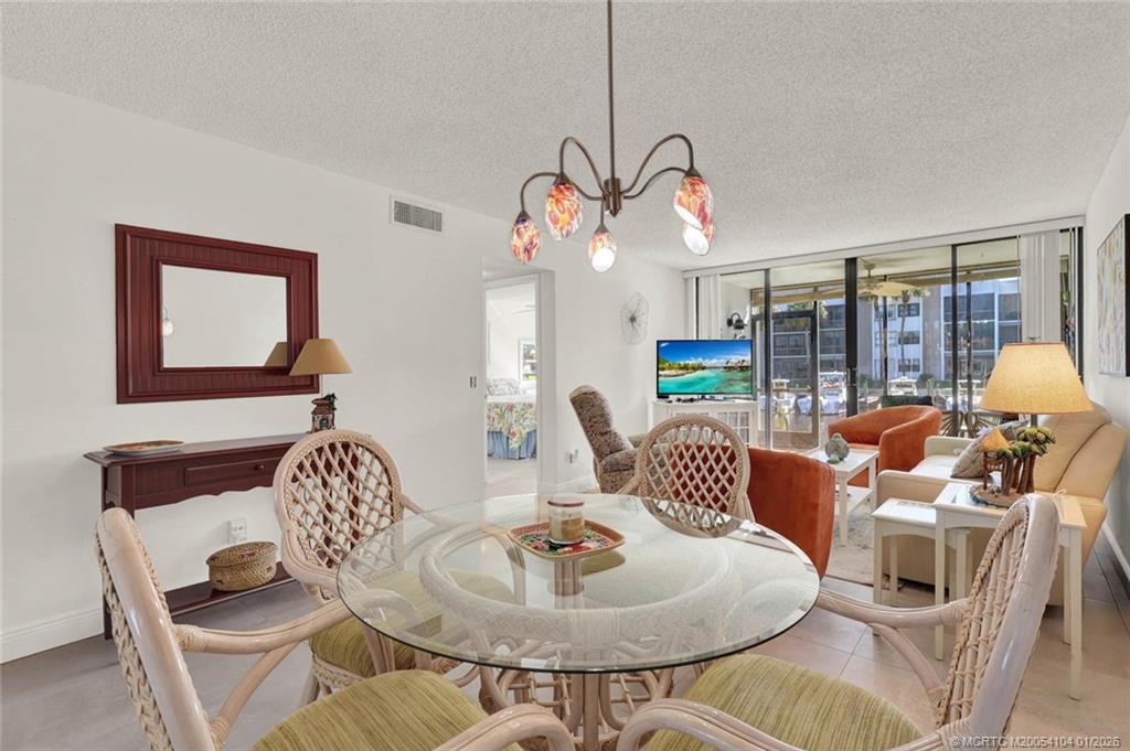 1950 Southwest Palm City Road, Unit 9102 Stuart, FL 34994 - Photo 13 of 51 a living room with furniture