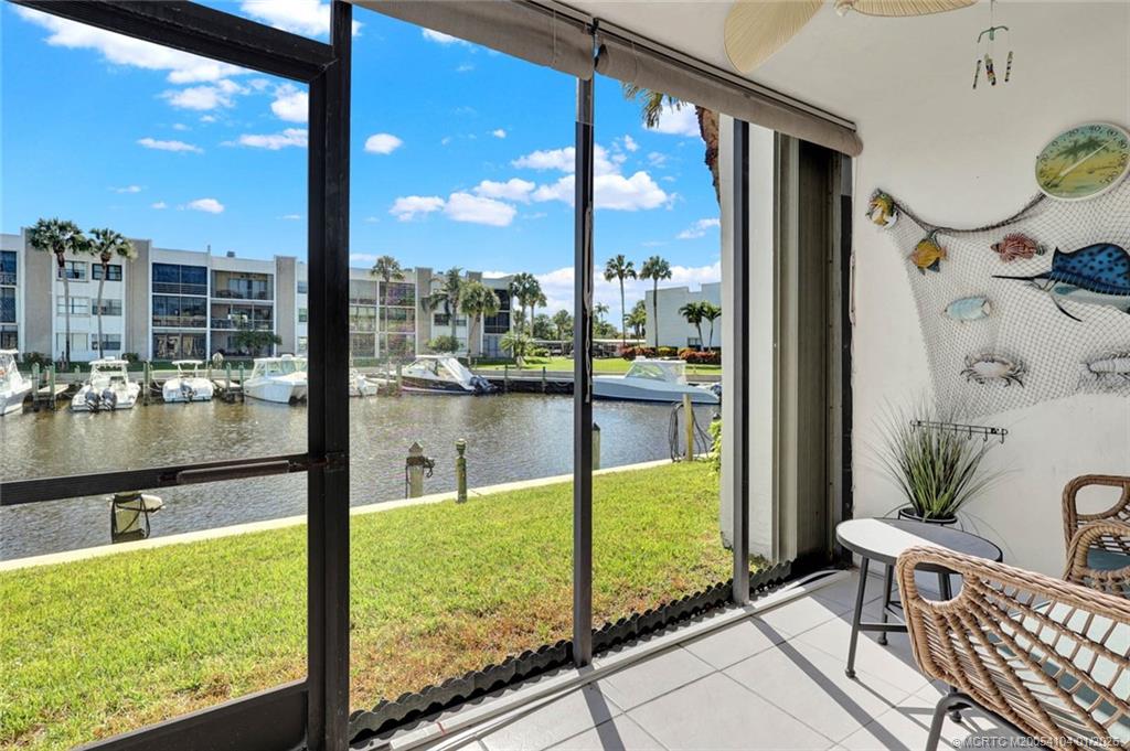 1950 Southwest Palm City Road, Unit 9102 Stuart, FL 34994 - Photo 20 of 51 a view of a from a living room and floor to ceiling window
