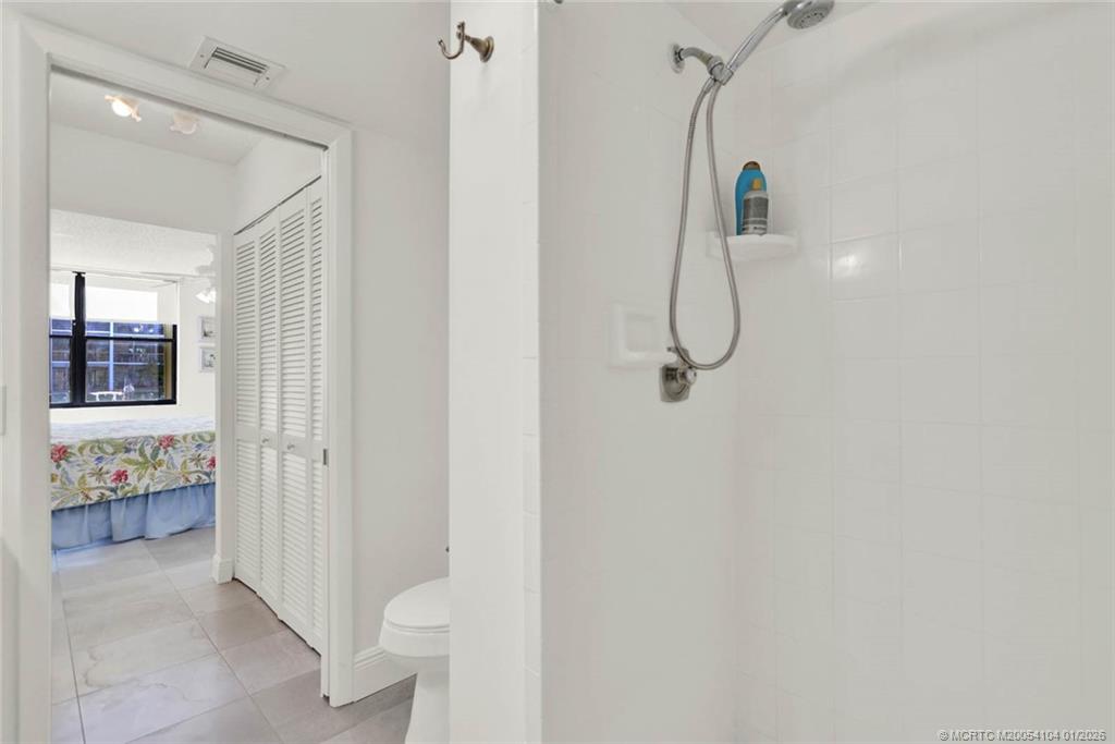 1950 Southwest Palm City Road, Unit 9102 Stuart, FL 34994 - Photo 28 of 51 a bathroom with a shower