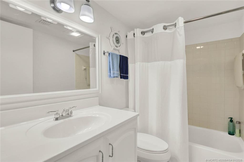 1950 Southwest Palm City Road, Unit 9102 Stuart, FL 34994 - Photo 32 of 51 a bathroom with a sink toilet and shower