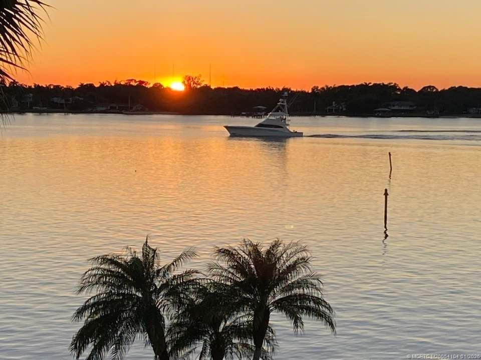 1950 Southwest Palm City Road, Unit 9102 Stuart, FL 34994 - Photo 35 of 51 a view of ocean with sunset