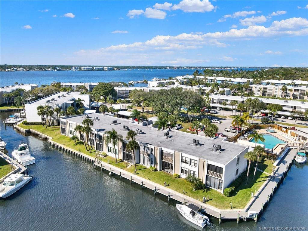 1950 Southwest Palm City Road, Unit 9102 Stuart, FL 34994 - Photo 5 of 51 an aerial view of residential houses with outdoor space