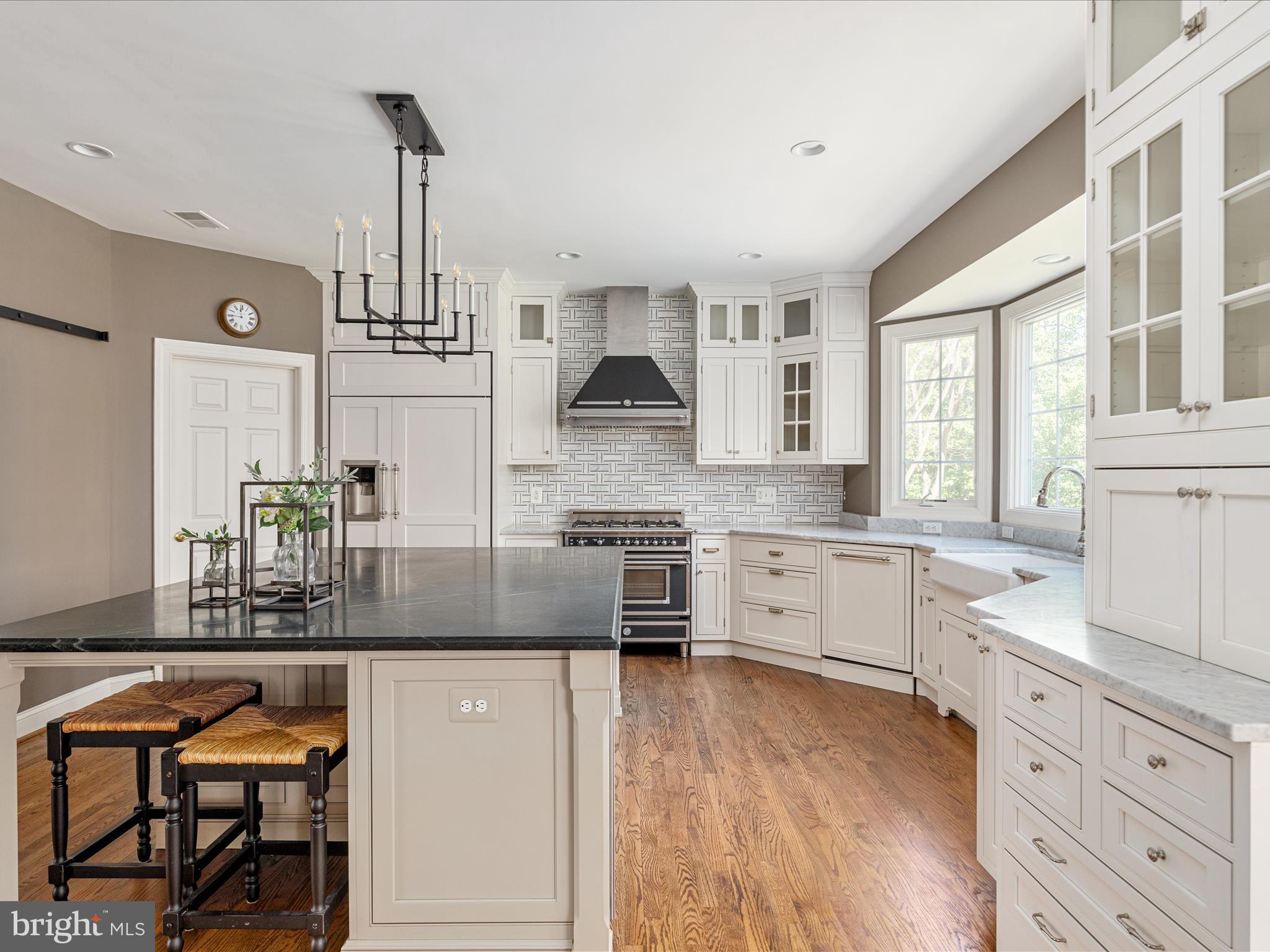 10554 Fox Forest Drive Great Falls, VA 22066 - Photo 11 of 77 a kitchen with stainless steel appliances a stove sink and cabinets