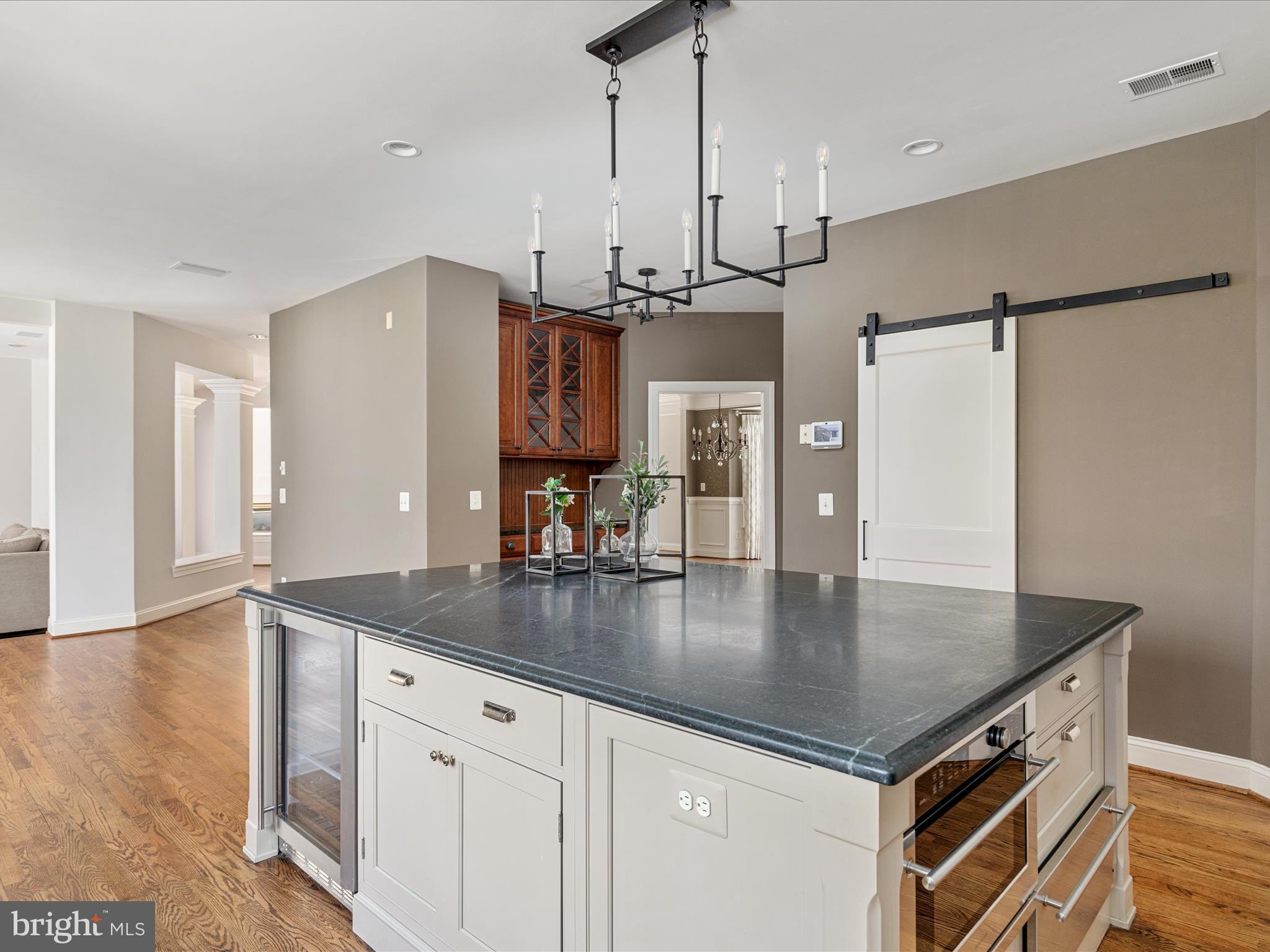 10554 Fox Forest Drive Great Falls, VA 22066 - Photo 12 of 77 a kitchen with stainless steel appliances granite countertop a sink a refrigerator and a granite counter tops