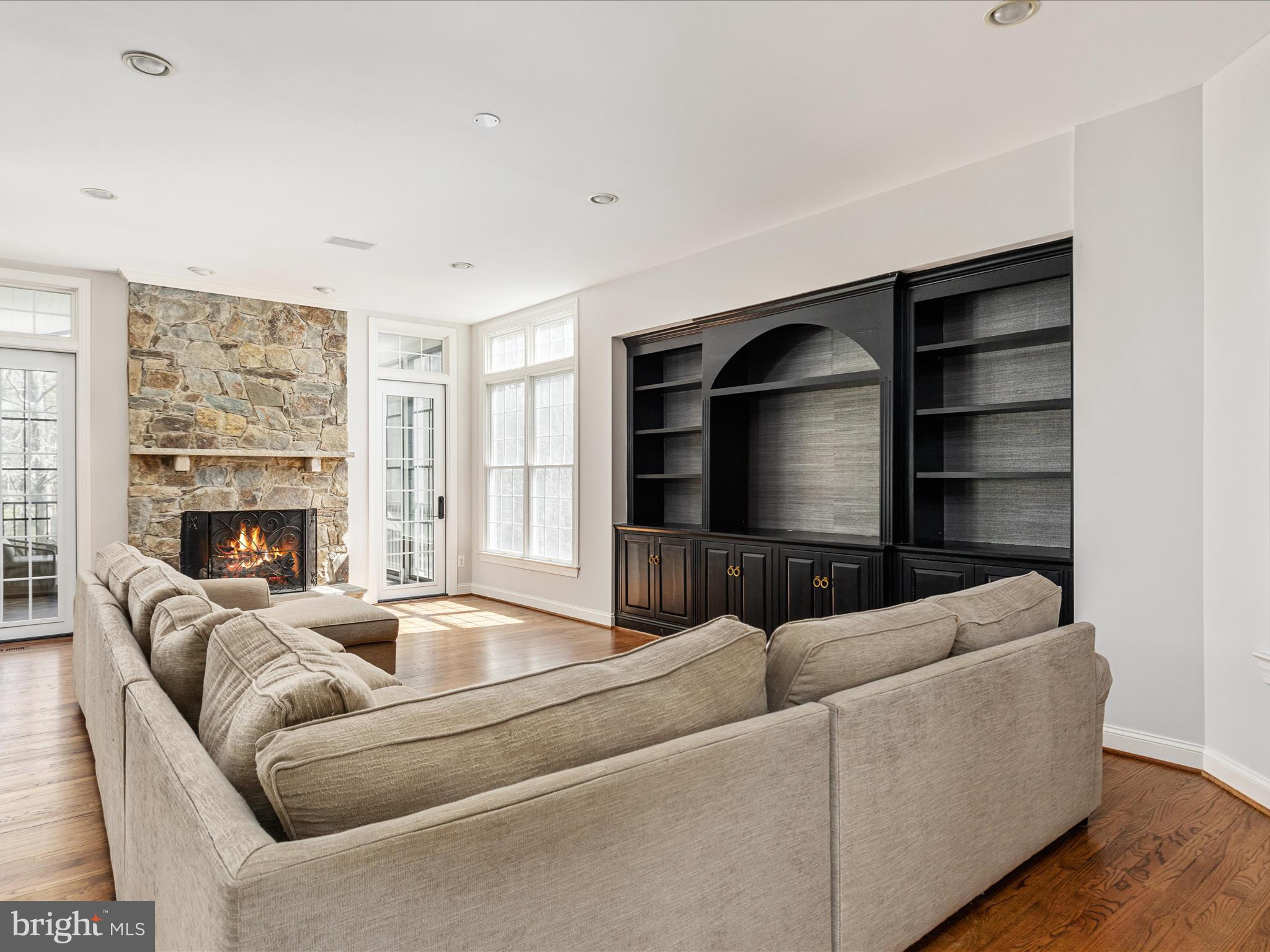10554 Fox Forest Drive Great Falls, VA 22066 - Photo 17 of 77 a living room with furniture and a fireplace