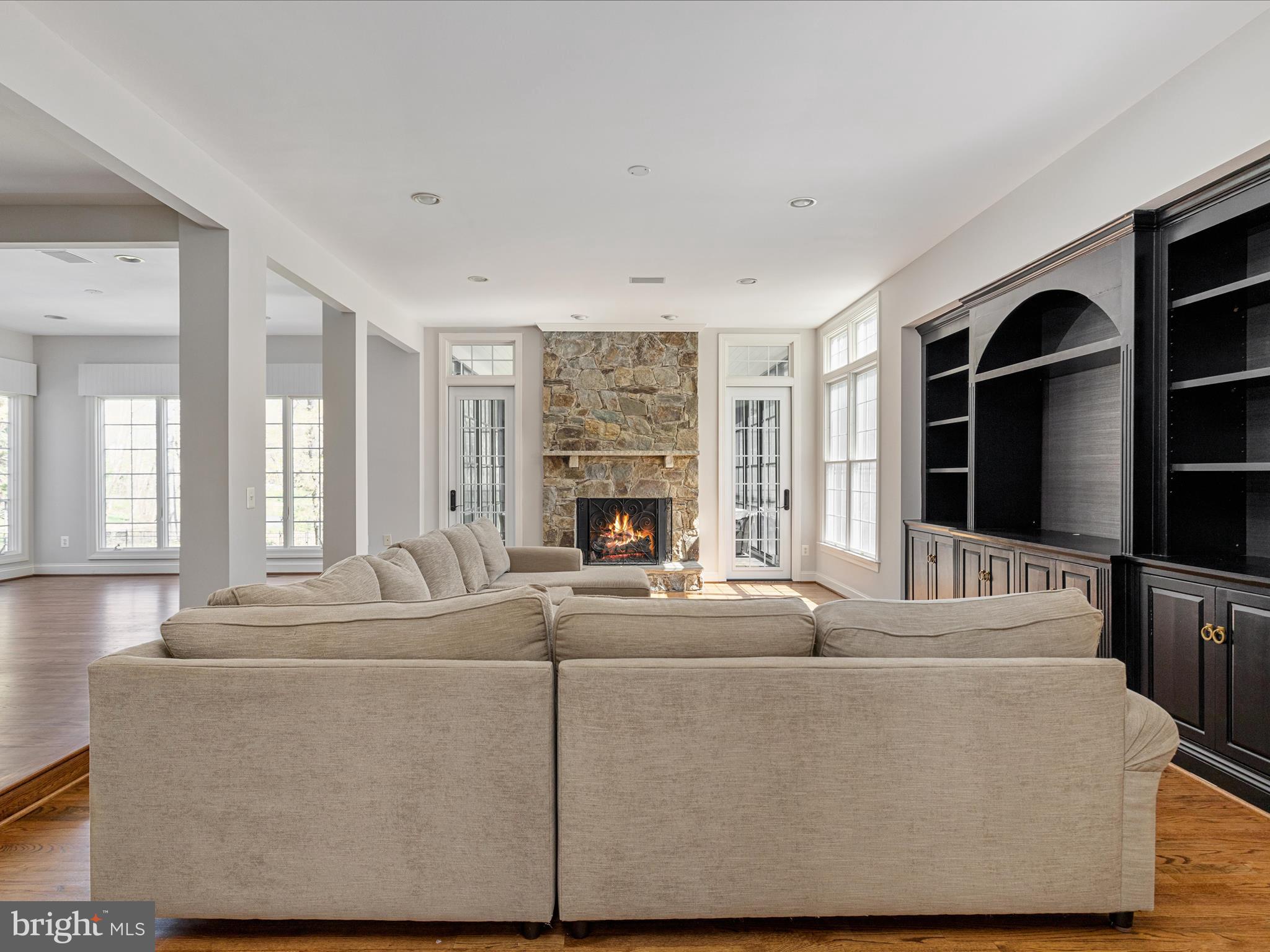 10554 Fox Forest Drive Great Falls, VA 22066 - Photo 18 of 77 a living room with furniture windows and flat screen tv