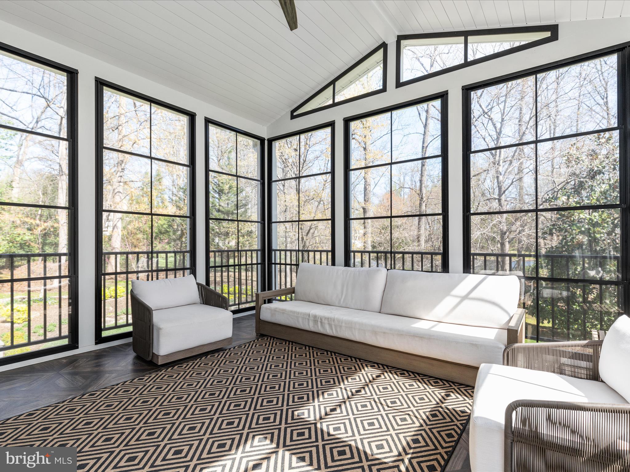 10554 Fox Forest Drive Great Falls, VA 22066 - Photo 19 of 77 a living room with furniture and a large window