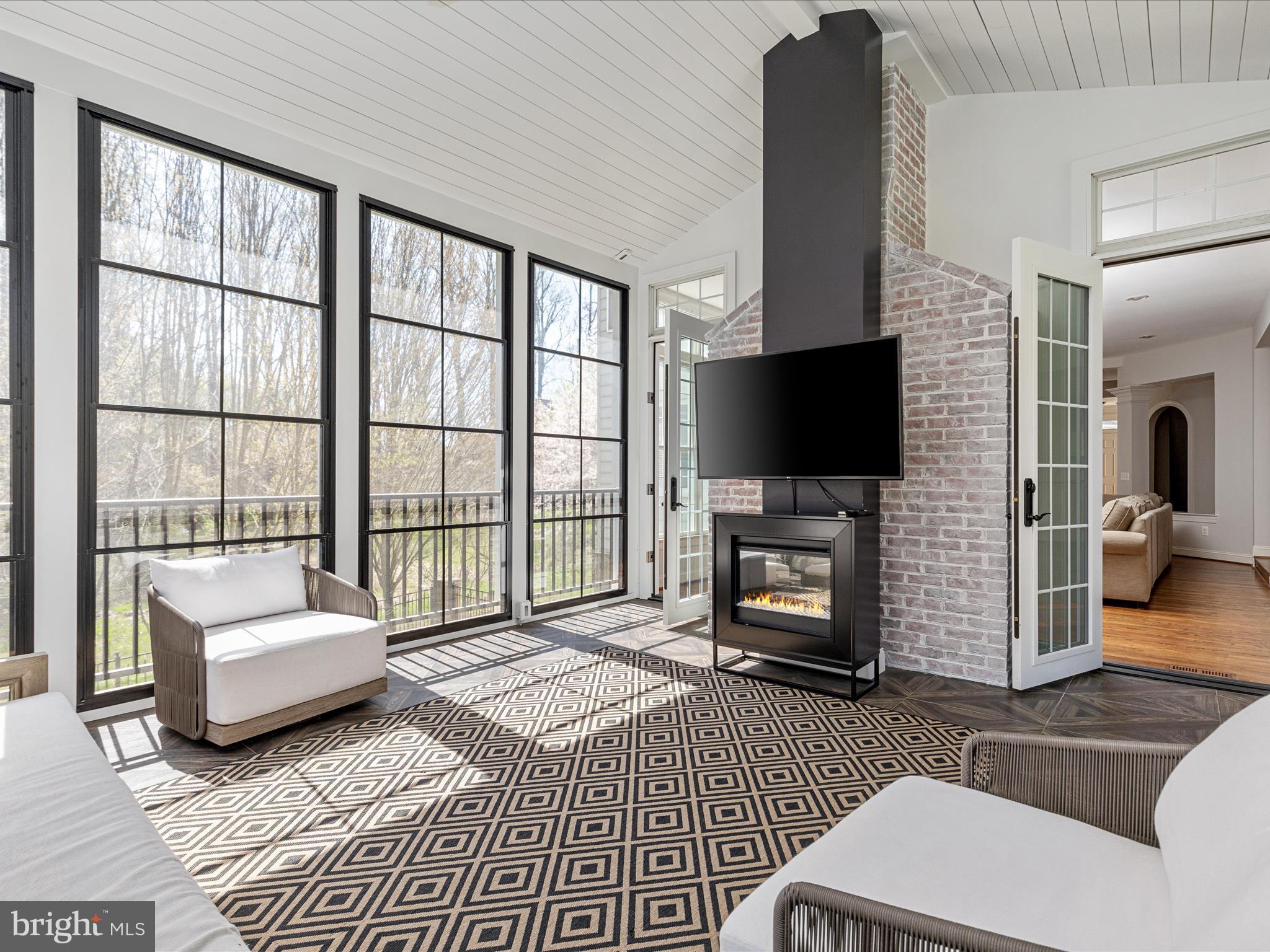 10554 Fox Forest Drive Great Falls, VA 22066 - Photo 21 of 77 a living room with furniture and a flat screen tv
