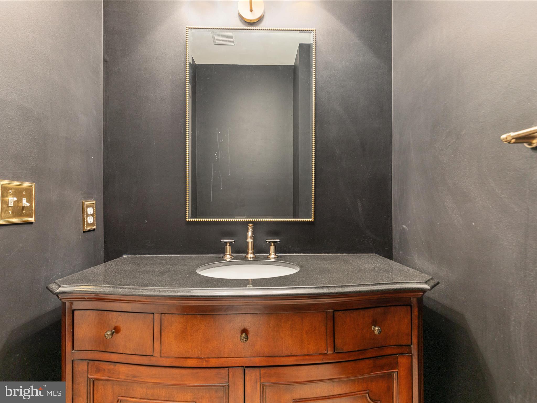 10554 Fox Forest Drive Great Falls, VA 22066 - Photo 23 of 77 a bathroom with a sink and a mirror