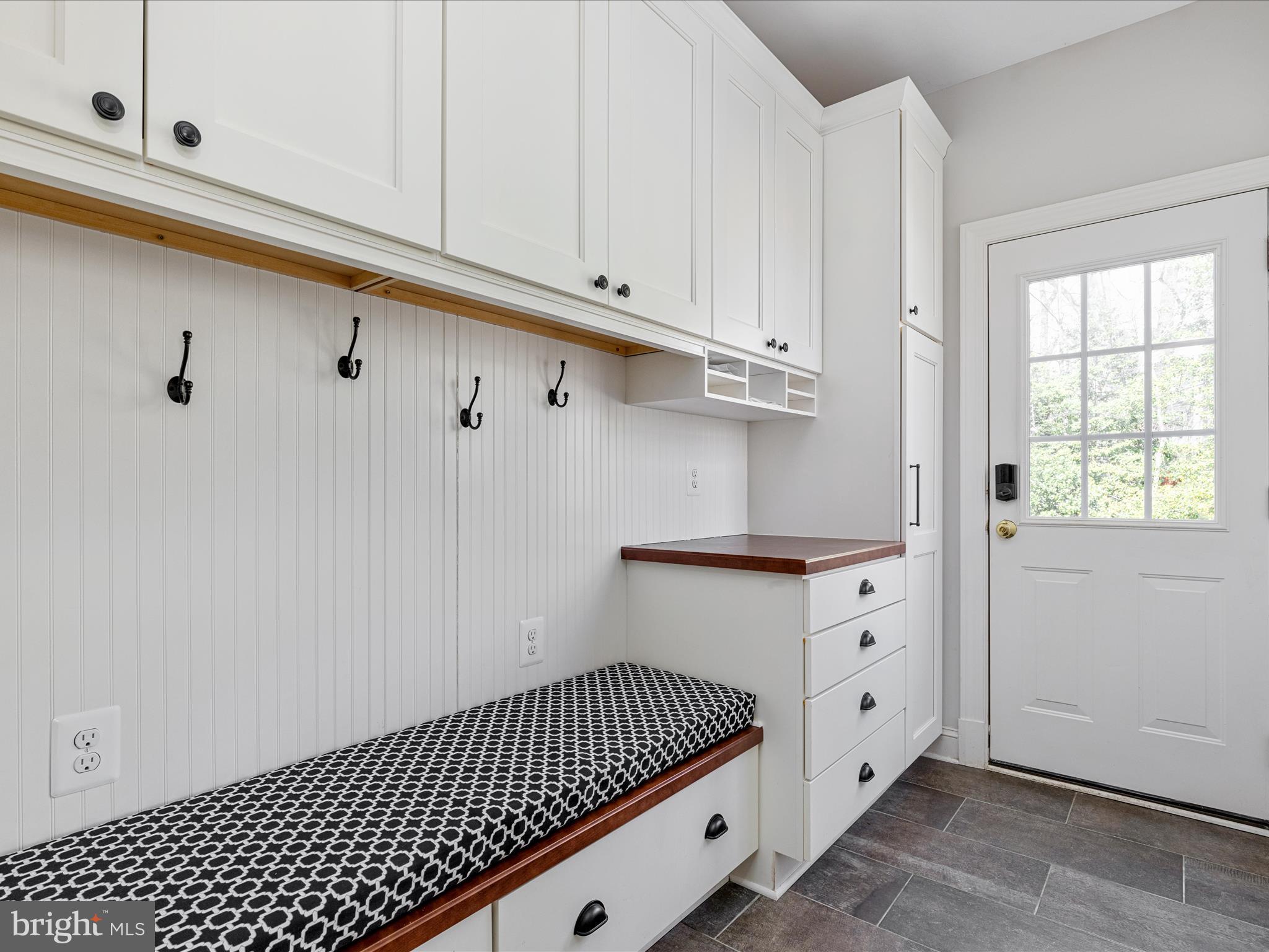 10554 Fox Forest Drive Great Falls, VA 22066 - Photo 24 of 77 a kitchen with white cabinets and window