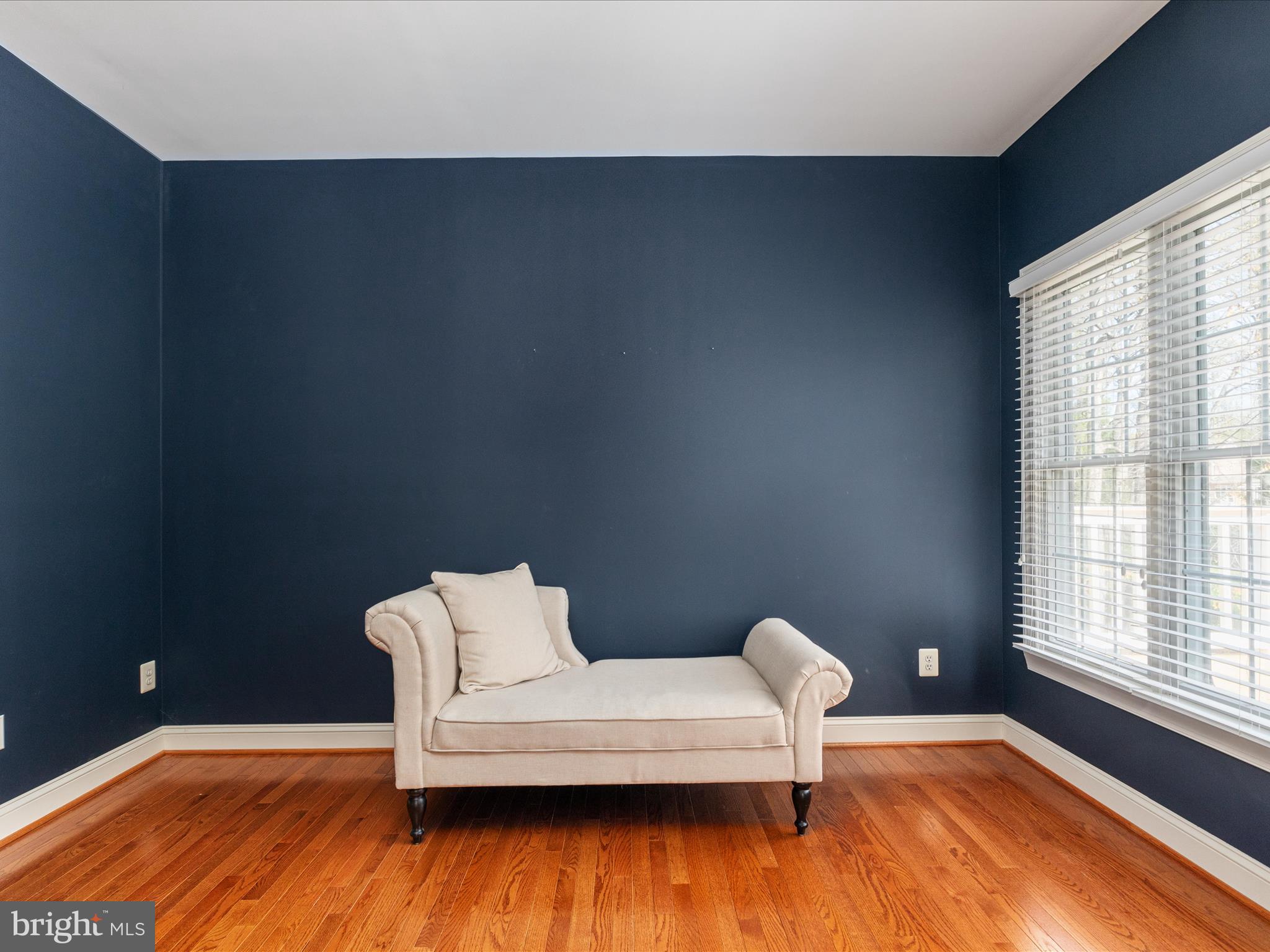 10554 Fox Forest Drive Great Falls, VA 22066 - Photo 27 of 77 a bedroom with a bed and wooden floor