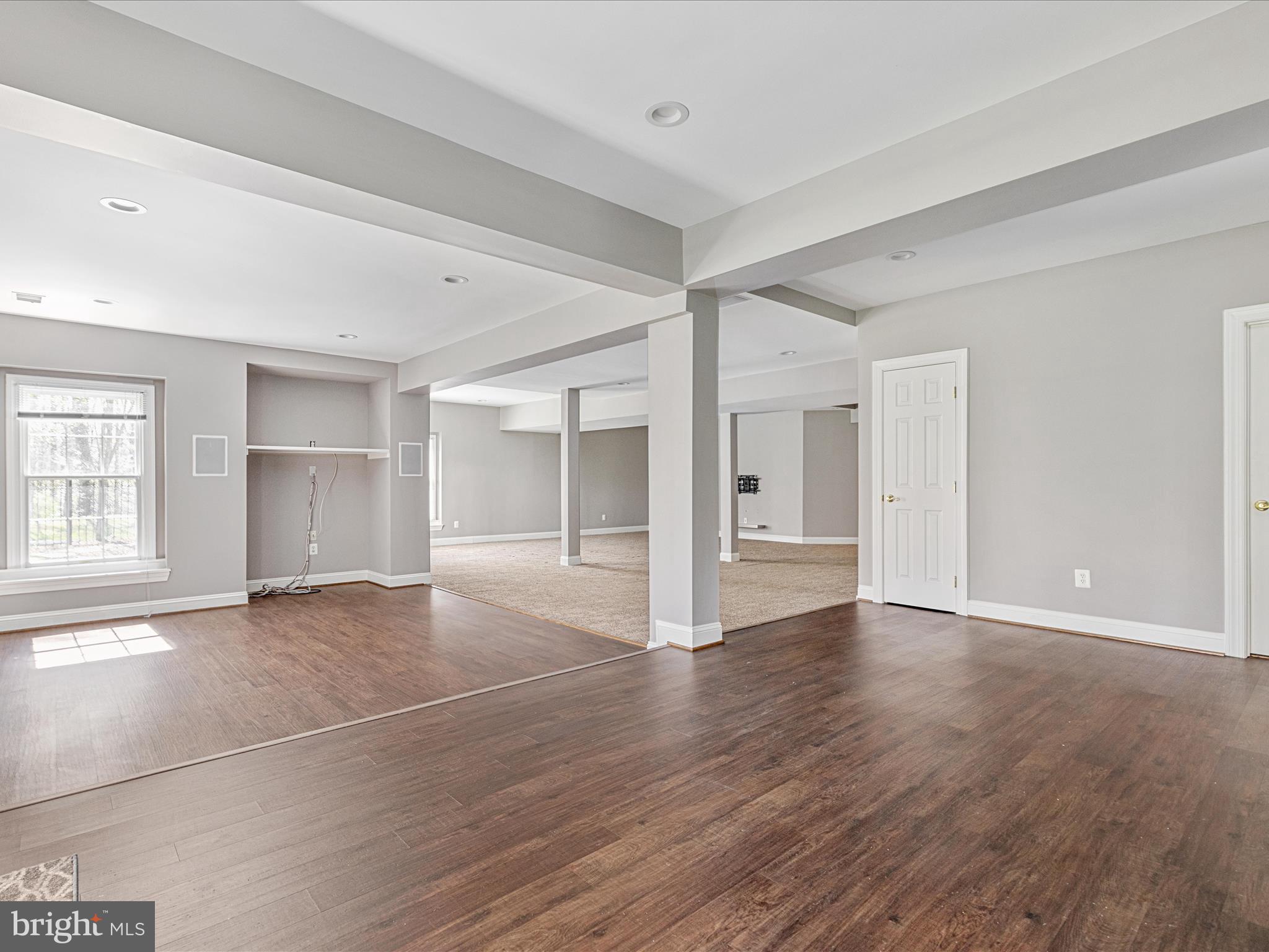 10554 Fox Forest Drive Great Falls, VA 22066 - Photo 48 of 77 a view of an empty room with window and wooden floor