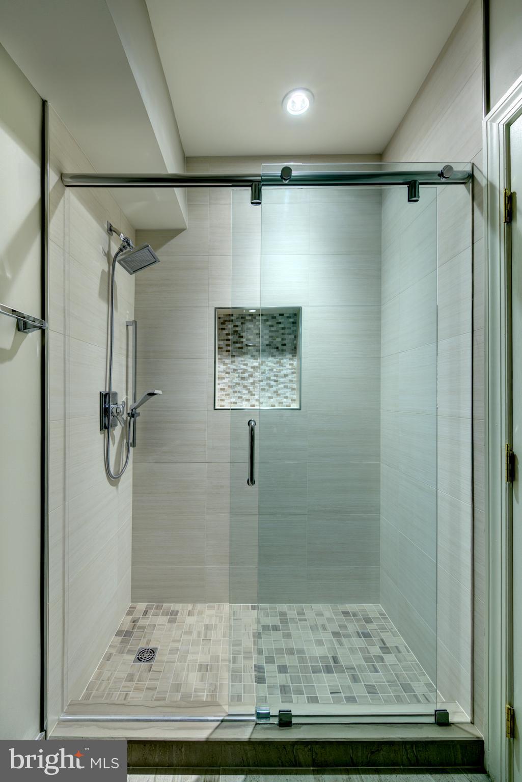 10554 Fox Forest Drive Great Falls, VA 22066 - Photo 52 of 77 a bathroom with a shower