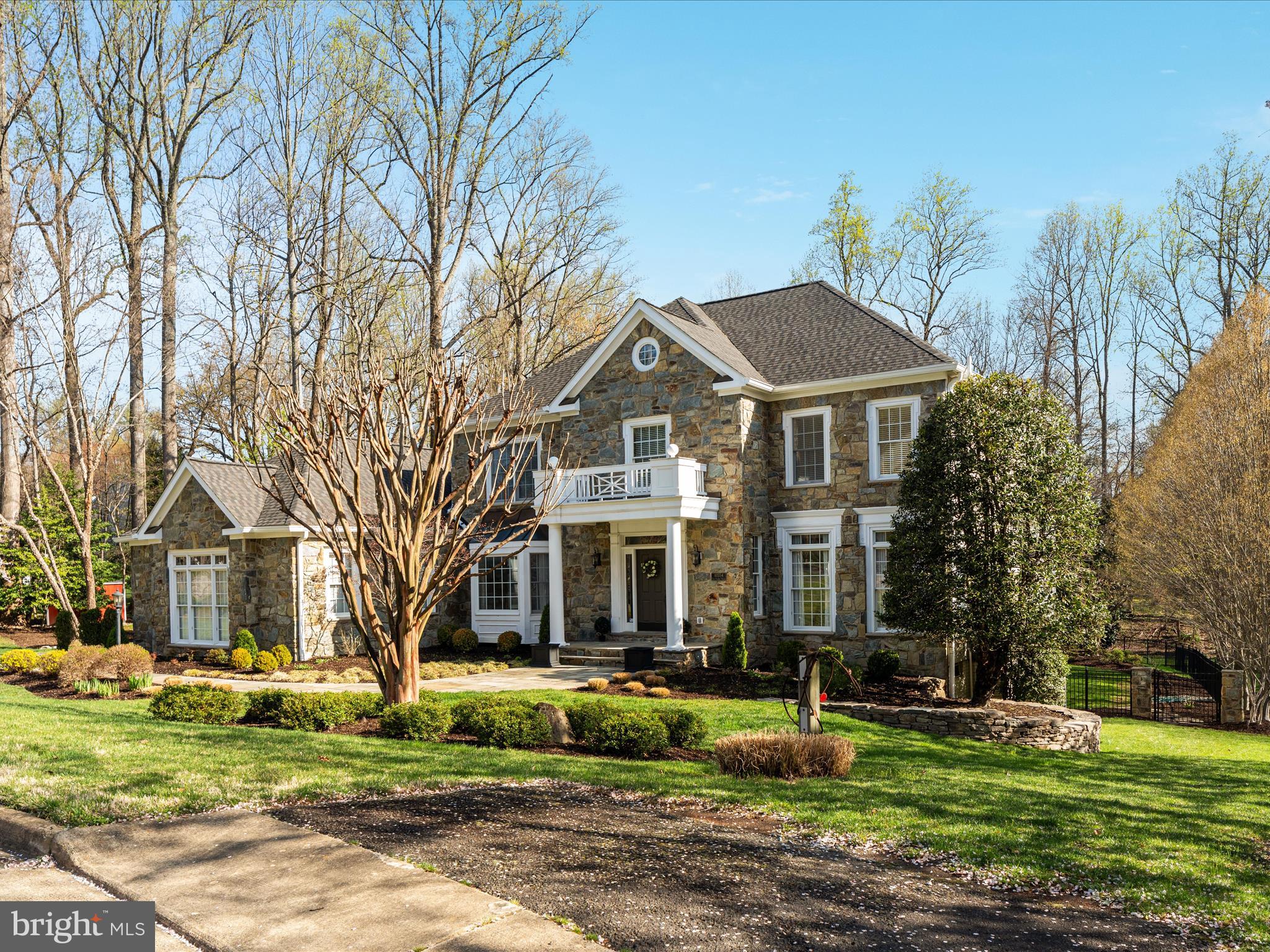 10554 Fox Forest Drive Great Falls, VA 22066 - Photo 54 of 77 a front view of a building with trees and trees