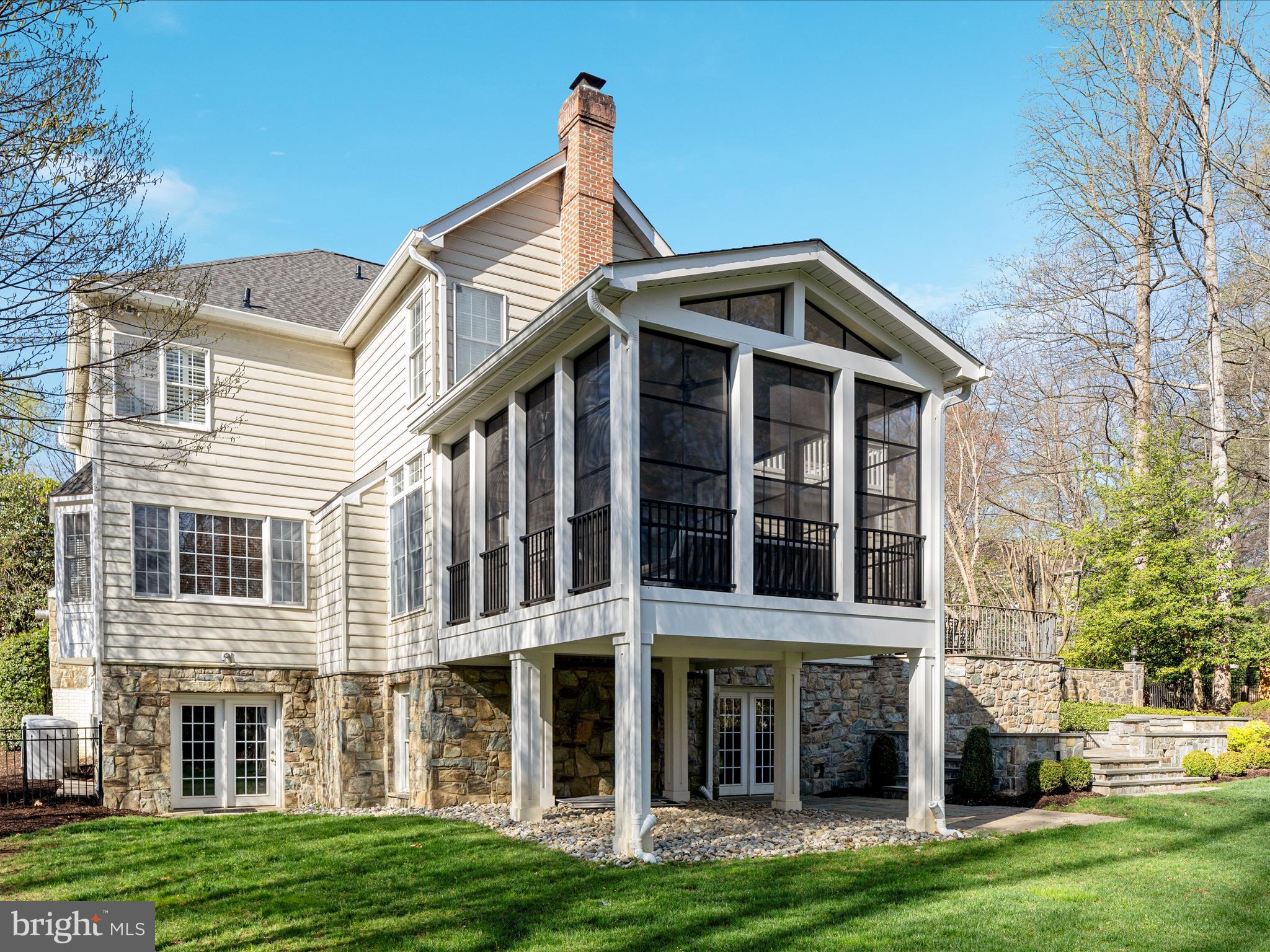 10554 Fox Forest Drive Great Falls, VA 22066 - Photo 59 of 77 a view of a big house with many windows and a big yard