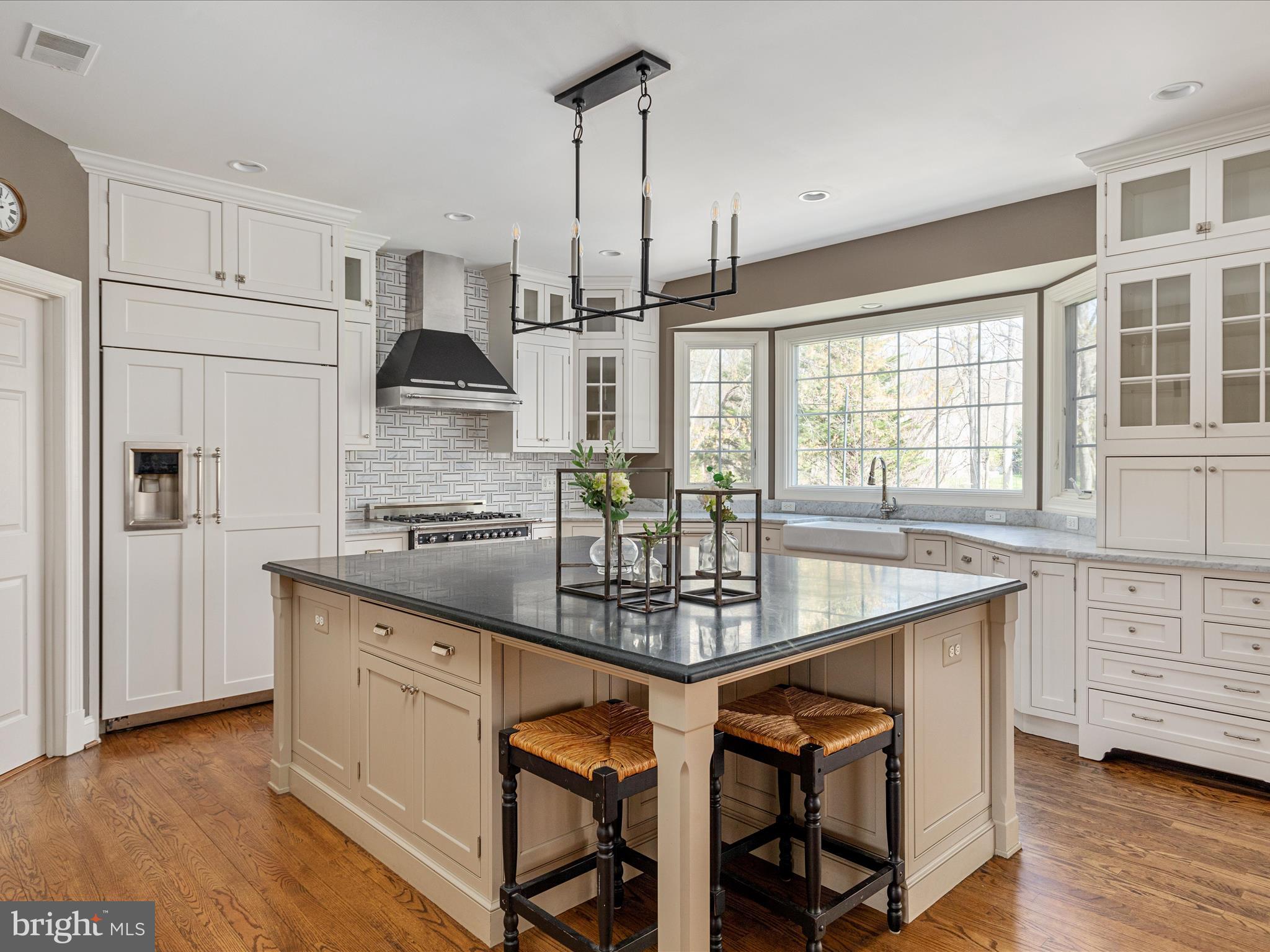 10554 Fox Forest Drive Great Falls, VA 22066 - Photo 9 of 77 a kitchen with stainless steel appliances granite countertop a sink stove and refrigerator