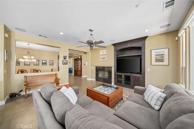 a bathroom with a granite countertop sink a large mirror and a shower