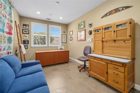 an aerial view of a house with a garden and plants