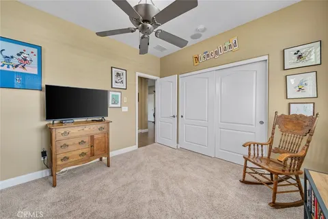 an aerial view of a residential apartment building with a yard and potted plants