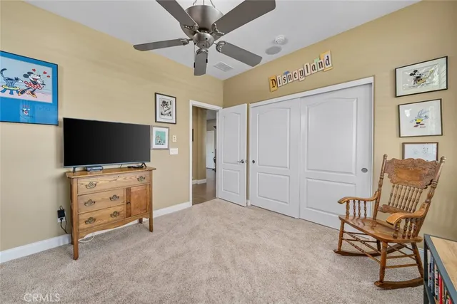 an aerial view of a residential apartment building with a yard and potted plants