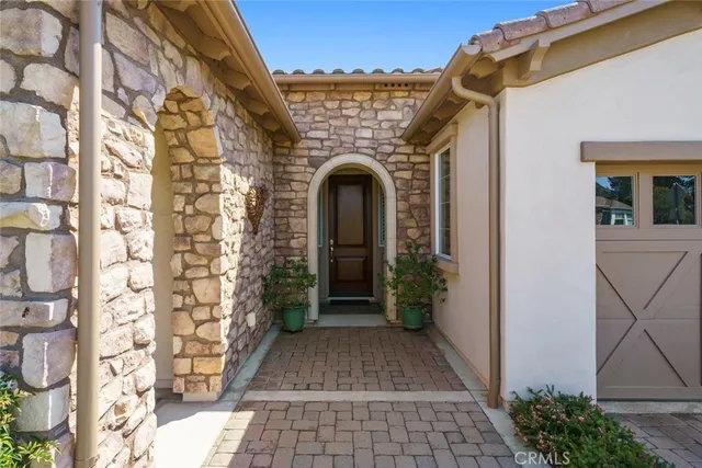 a living room with furniture a window and a fireplace