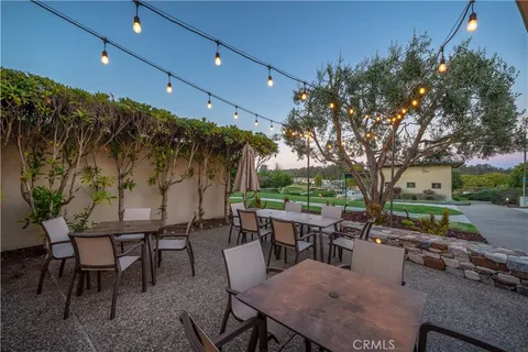 a view of a patio with a table and chairs