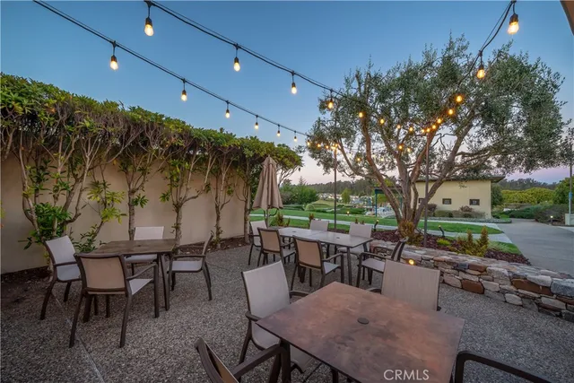 a view of a patio with a table and chairs