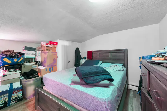 a bedroom with a bed and a dresser