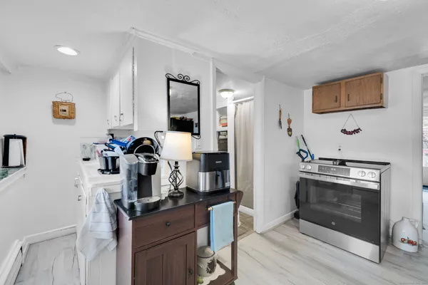 a kitchen with a stove and a refrigerator
