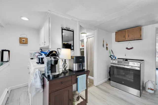 a kitchen with a stove and a refrigerator