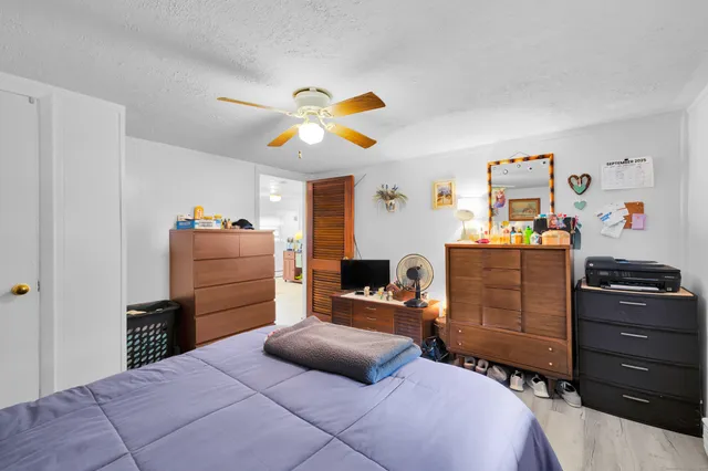 a bedroom with a bed and furniture