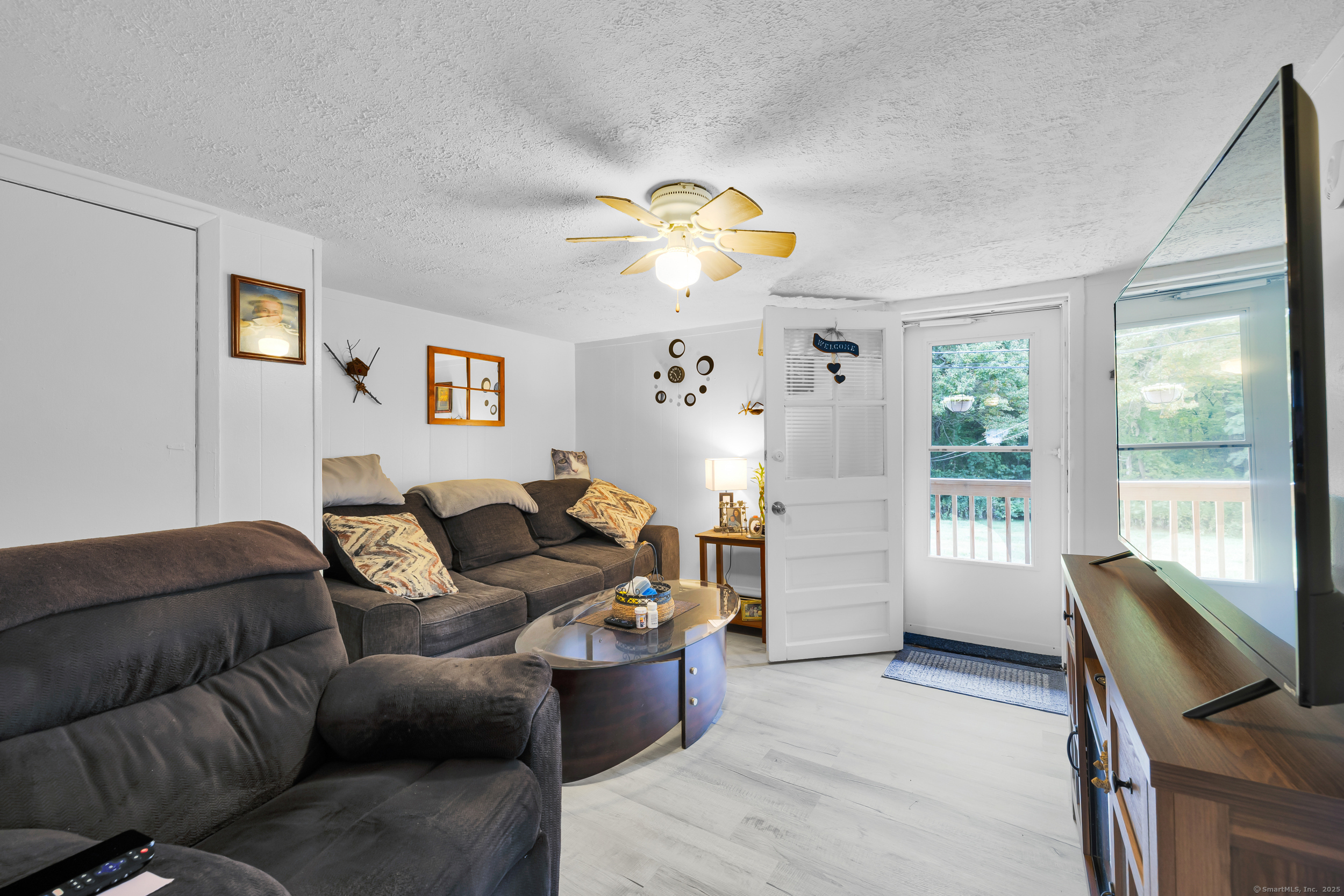 1259 Wolcott Road Wolcott, CT 06716 - Photo 29 of 30 a living room with furniture and a window
